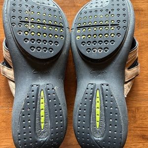 Women’s size 9.5 Clark sandals, brown in color.